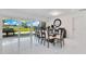 Elegant dining room with marble floors and a view of the waterway, perfect for entertaining guests at 49 Interlaken Rd, Orlando, FL 32804