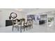 Open-concept dining room with marble flooring, modern lighting, and a seamless transition to the gourmet kitchen at 49 Interlaken Rd, Orlando, FL 32804