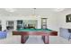 Game room with billiard table, marble floors, and gray cabinets at 49 Interlaken Rd, Orlando, FL 32804