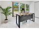 Bright office space featuring marble floors, an accent plant, and expansive windows at 49 Interlaken Rd, Orlando, FL 32804