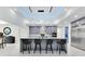 Modern kitchen with a large central island, bar stool seating, and stainless steel appliances at 49 Interlaken Rd, Orlando, FL 32804