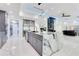 Gourmet kitchen with a spacious island, wine rack, and modern stainless steel appliances at 49 Interlaken Rd, Orlando, FL 32804