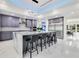 Modern kitchen with a large island, stainless steel appliances, and stylish gray cabinetry at 49 Interlaken Rd, Orlando, FL 32804