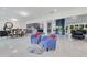 Spacious living room featuring modern furnishings and an open floor plan with marble flooring at 49 Interlaken Rd, Orlando, FL 32804