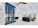 Open-concept living area with modern wine storage, marble floors, and seamless transitions to other rooms at 49 Interlaken Rd, Orlando, FL 32804