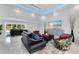 Bright living room featuring recessed lighting, modern furnishings, and a view to the front yard at 49 Interlaken Rd, Orlando, FL 32804