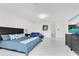 Spacious bedroom featuring an expansive floor, modern lighting, and sleek furniture at 49 Interlaken Rd, Orlando, FL 32804