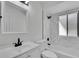 Bathroom featuring white marble style tiling and modern black fixtures at 4940 Spring Run Ave, Orlando, FL 32819