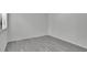 Bedroom with gray wood flooring, white trim and walls, and a window at 4940 Spring Run Ave, Orlando, FL 32819