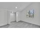 Bright bedroom with modern closet and gray wood flooring at 4940 Spring Run Ave, Orlando, FL 32819