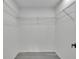 Walk-in closet with white walls, wood flooring, and wire shelving at 4940 Spring Run Ave, Orlando, FL 32819
