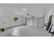 Spacious two-car garage with a window, white walls, and overhead lighting at 4940 Spring Run Ave, Orlando, FL 32819