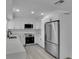 Beautiful kitchen featuring white cabinetry, stainless steel appliances and granite countertops at 4940 Spring Run Ave, Orlando, FL 32819