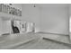 Spacious living room with high ceilings, wood-look floors, and a modern staircase at 4940 Spring Run Ave, Orlando, FL 32819