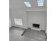 Bright living room featuring skylights, a fireplace, and hardwood flooring at 4940 Spring Run Ave, Orlando, FL 32819