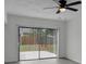 Cozy sunroom featuring backyard views, a ceiling fan, and sliding glass doors at 4940 Spring Run Ave, Orlando, FL 32819