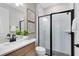 Modern bathroom featuring a glass-enclosed shower, elegant vanity, and contemporary fixtures at 5166 Gardenrow Dr, St Cloud, FL 34772