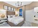 Stylish bedroom showcasing a neutral color palette, plush carpet, and chic furnishings under modern lighting at 5166 Gardenrow Dr, St Cloud, FL 34772