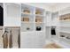 Well-organized walk-in closet with built-in shelving, drawers, and ample storage space at 5166 Gardenrow Dr, St Cloud, FL 34772