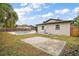 Spacious backyard featuring a swimming pool, concrete patio, and well-maintained fencing at 5334 Mary Ann Ln, Orlando, FL 32810