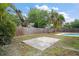 Spacious backyard with a concrete pad, offering potential for outdoor activities and landscaping at 5334 Mary Ann Ln, Orlando, FL 32810