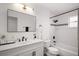 Updated bathroom showcasing modern fixtures, a large mirror, and a shower-tub combination at 5334 Mary Ann Ln, Orlando, FL 32810