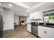 Well-lit kitchen with stainless steel appliances, granite countertops, and updated cabinets at 5334 Mary Ann Ln, Orlando, FL 32810