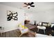 Inviting living room with contemporary decor, stylish flooring, and open layout with a ceiling fan at 5334 Mary Ann Ln, Orlando, FL 32810