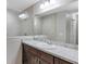 Modern bathroom with granite vanity, mirror and shower/bathtub combination at 57 Pine Trace Crse, Ocala, FL 34472