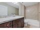 Modern bathroom with granite vanity, mirror and shower/bathtub combination at 57 Pine Trace Crse, Ocala, FL 34472