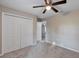 Bright bedroom with carpeting, ceiling fan, closet and plenty of space at 57 Pine Trace Crse, Ocala, FL 34472