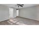 Spacious carpeted bedroom with multiple doorways at 57 Pine Trace Crse, Ocala, FL 34472