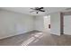 Carpeted bedroom featuring a ceiling fan at 57 Pine Trace Crse, Ocala, FL 34472