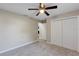 Bright bedroom with carpeting, ceiling fan, closet and plenty of space at 57 Pine Trace Crse, Ocala, FL 34472