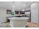 A modern kitchen featuring stainless steel appliances, a large island, and attractive cabinets at 57 Pine Trace Crse, Ocala, FL 34472