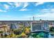 Overlooking scenic lake with a building displaying the Ramada Plaza on a sunny day at 6165 Carrier Dr # 2001, Orlando, FL 32819