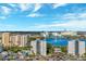 Beautiful aerial view overlooking the lake and resort with many amenities and sunny skies at 6165 Carrier Dr # 2001, Orlando, FL 32819