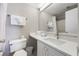 Bathroom features a toilet, vanity with sink, and shower-tub combo at 6165 Carrier Dr # 2001, Orlando, FL 32819