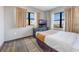 Cozy bedroom features a TV atop dresser, a large window, and comfortable design at 6165 Carrier Dr # 2001, Orlando, FL 32819
