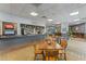 Dining area with tables, chairs, market, drink station, and bar at 6165 Carrier Dr # 2001, Orlando, FL 32819