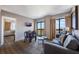 Bright living space with a sofa, small eating area, and large windows overlooking the lake at 6165 Carrier Dr # 2001, Orlando, FL 32819