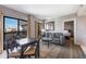 Living area with a dining table, sofa, and sliding glass doors leading to the balcony with a view at 6165 Carrier Dr # 2001, Orlando, FL 32819