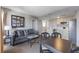A well-lit living room with a cozy sofa, stylish decor, and a kitchen area with modern appliances at 6165 Carrier Dr # 2001, Orlando, FL 32819