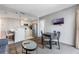 A comfortable living space with a kitchen, dining area, and a television for entertainment at 6165 Carrier Dr # 2001, Orlando, FL 32819