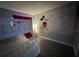 Fun bedroom with bunk beds and a unique Mickey Mouse themed accent wall creating a playful space at 6165 Carrier Dr # 3104, Orlando, FL 32819