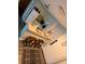 Overhead shot of the cozy kitchen with white cabinets and breakfast bar at 6165 Carrier Dr # 3104, Orlando, FL 32819