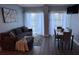 Comfortable living room and dining area with large windows and ample seating at 6165 Carrier Dr # 3104, Orlando, FL 32819