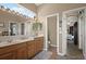 Bathroom featuring a dual sink vanity with a separate toilet room and shower at 625 Waterland Ct, Orlando, FL 32828