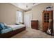 Cozy bedroom with neutral tones, carpeted floors, and a closet for storage at 625 Waterland Ct, Orlando, FL 32828