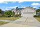 Charming single-story home features a well-manicured lawn, solar panels and a two-car garage at 625 Waterland Ct, Orlando, FL 32828
